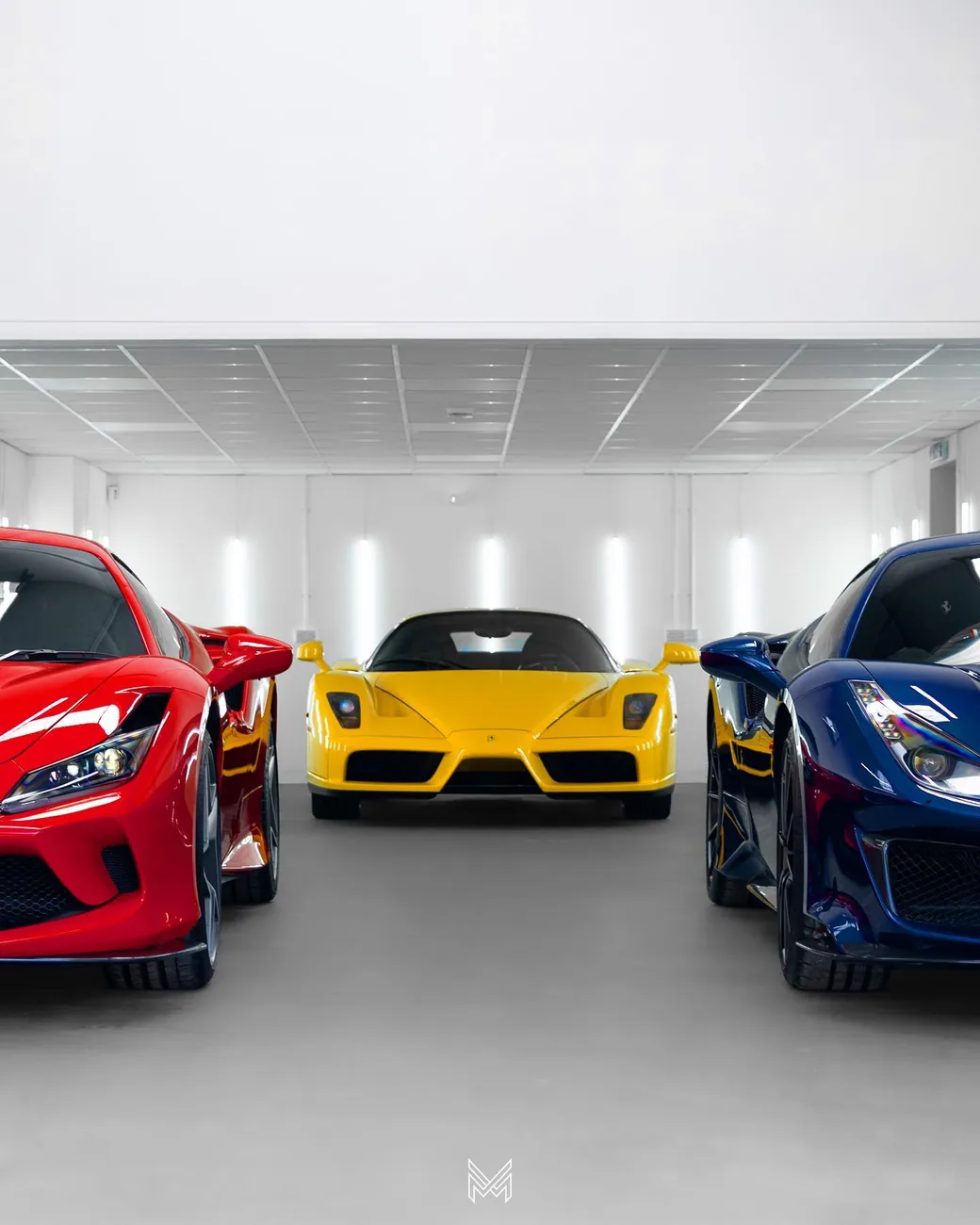 A collection of Ferraris — including an Enzo — in the Meraki Motorworks unit