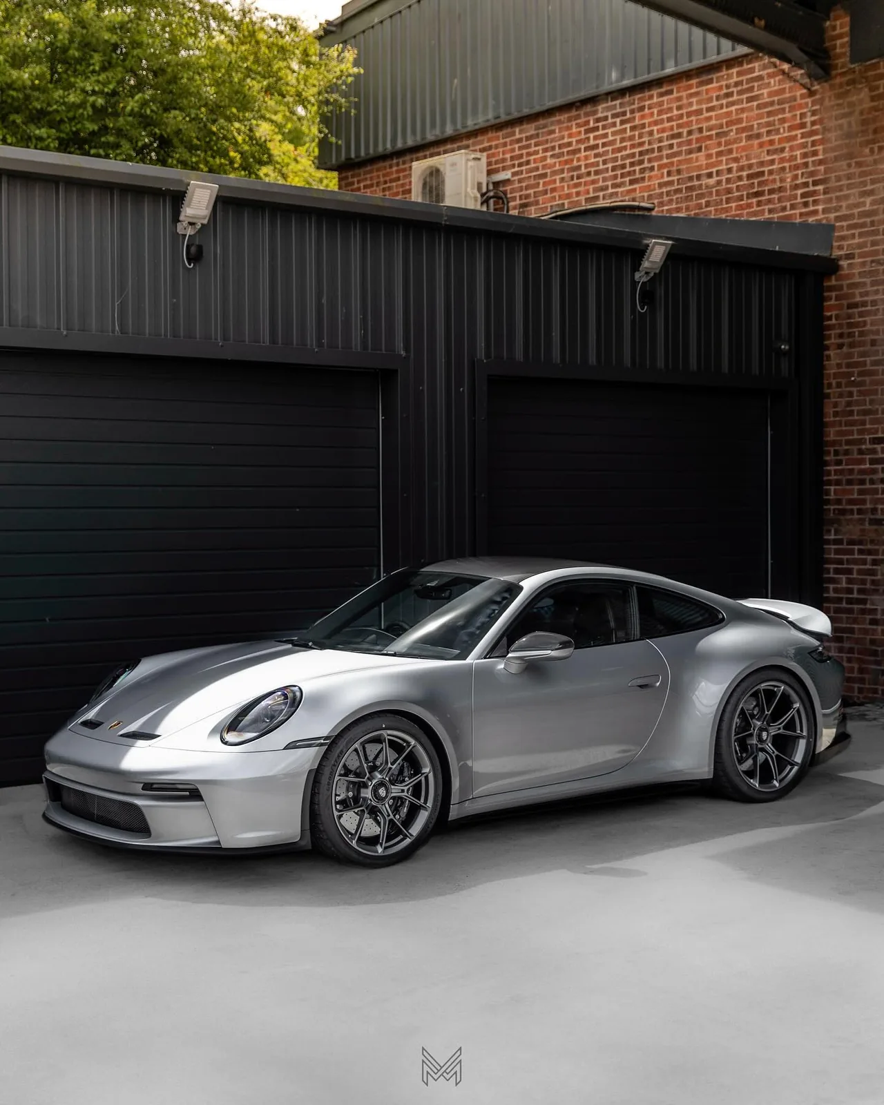 Silver Porsche 911 GT3 with a corrected, mirror-finish paintwork