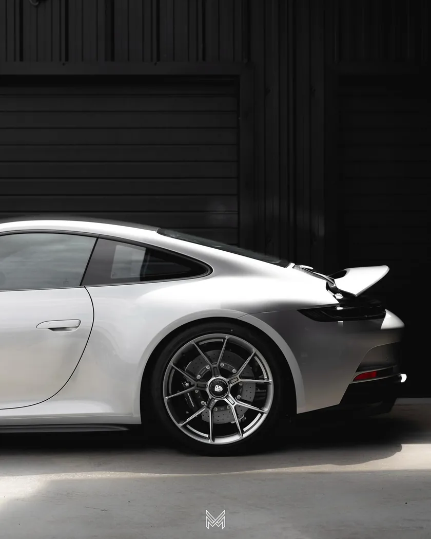 White Porsche 911 GT3 Touring, rear quarter and centre-lock wheel