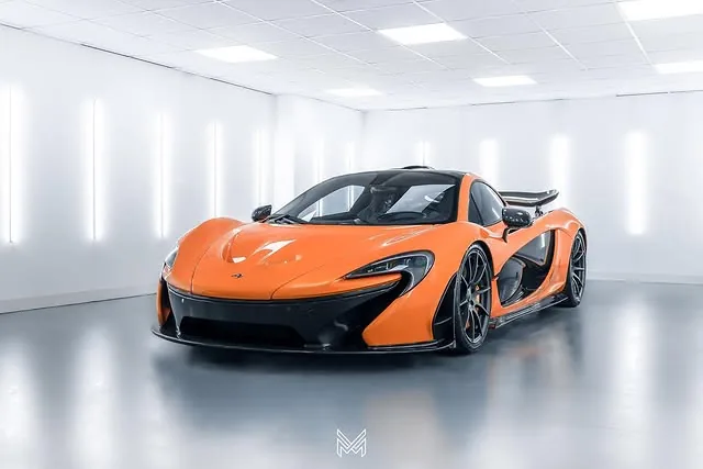 Orange McLaren P1 under studio lighting